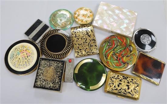 A Victorian mother of pearl purse, lipstick case, twelve compacts, etc